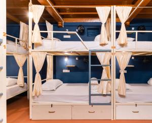 a room with bunk beds in a hostel at Moustache Daman in Daman