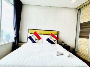 Voodi või voodid majutusasutuse Vortex Serviced Apartment KLCC By Elite Suites toas