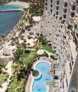 an aerial view of the pool at the resort at Penthouse Urbanizacion Montemarina Anfi del Mar in Mogán