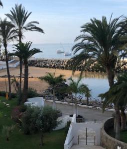 a view of the beach from a resort at Penthouse Urbanizacion Montemarina Anfi del Mar in Mogán