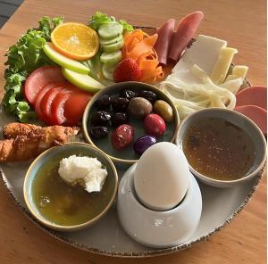 a plate of food with different types of food at Galata Master Hotel in Istanbul