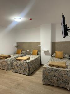 Postel nebo postele na pokoji v ubytování Hotel Quitagolpe