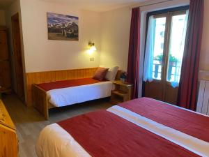 Postel nebo postele na pokoji v ubytování Hotel Col Serena