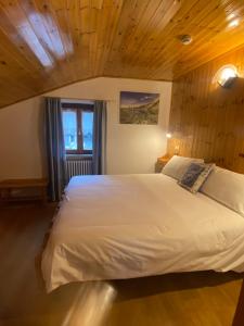 Postel nebo postele na pokoji v ubytování Hotel Col Serena
