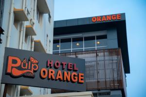 a hotel orange sign in front of a building at Hotel Orange in Bhubaneshwar