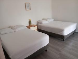 Postel nebo postele na pokoji v ubytování Casa BOSQUE LUCIERNAGAS