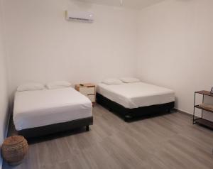 Postel nebo postele na pokoji v ubytování Casa BOSQUE LUCIERNAGAS