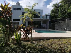 Bazén v ubytování Casa BOSQUE LUCIERNAGAS nebo v jeho okolí