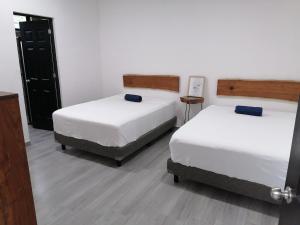Postel nebo postele na pokoji v ubytování Casa BOSQUE LUCIERNAGAS