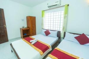 Postel nebo postele na pokoji v ubytování Blue Ocean Hotel - Thiên Thanh - sát bãi sau