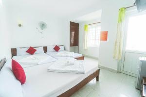 Postel nebo postele na pokoji v ubytování Blue Ocean Hotel - Thiên Thanh - sát bãi sau