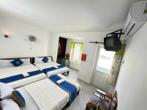 Postel nebo postele na pokoji v ubytování Blue Ocean Hotel - Thiên Thanh - sát bãi sau