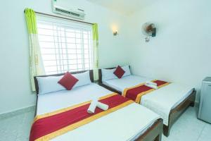 Postel nebo postele na pokoji v ubytování Blue Ocean Hotel - Thiên Thanh - sát bãi sau