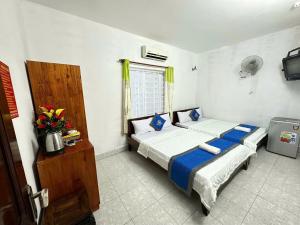 Postel nebo postele na pokoji v ubytování Blue Ocean Hotel - Thiên Thanh - sát bãi sau
