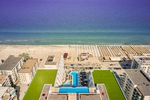 an aerial view of a resort and the beach at Vogue Sunrise View in Infinity Pool & Spa Resort in Mamaia Sat/Năvodari