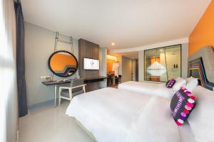 Voodi või voodid majutusasutuse Hotel Selene Chiang Rai toas
