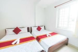 Postel nebo postele na pokoji v ubytování Blue Ocean Hotel - Thiên Thanh - sát bãi sau