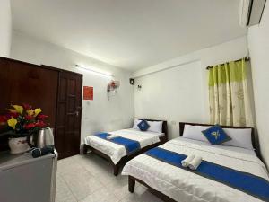 Postel nebo postele na pokoji v ubytování Blue Ocean Hotel - Thiên Thanh - sát bãi sau