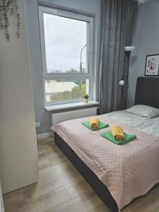 Posteľ alebo postele v izbe v ubytovaní Urban Jungle - Grey Apartment
