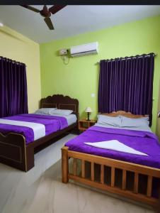 Postel nebo postele na pokoji v ubytování Quality Inn Varkala + 27 fotografií
