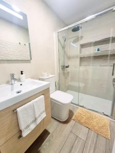 a bathroom with a shower and a sink and a toilet at Vivienda El Viajero in Valverde
