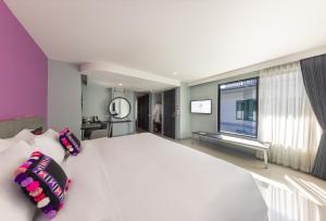 Voodi või voodid majutusasutuse Hotel Selene Chiang Rai toas