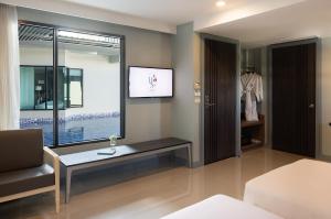 Voodi või voodid majutusasutuse Hotel Selene Chiang Rai toas