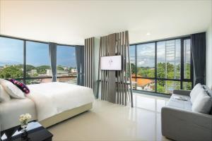 Voodi või voodid majutusasutuse Hotel Selene Chiang Rai toas