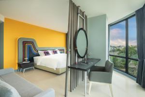 Voodi või voodid majutusasutuse Hotel Selene Chiang Rai toas