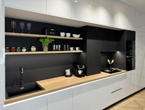 Η κουζίνα ή μικρή κουζίνα στο GRAND Apartments Banská Bystrica CENTRUM