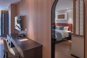 Postel nebo postele na pokoji v ubytování 重庆文里苗品茶艺术酒店Chongqing Jiangbei Airport Creative Park Store
