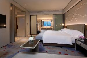 Voodi või voodid majutusasutuse InterContinental Quanzhou by IHG toas