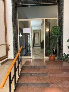a hallway of a building with a glass door at Gianicolo House in Rome
