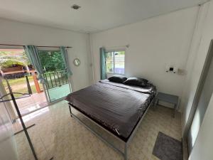 Postel nebo postele na pokoji v ubytování Janzo House