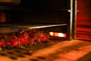 a pizza is being cooked in an oven at VILLA COMMUNICO,Nara in Nara