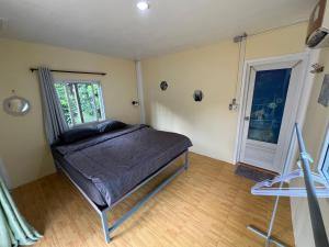 Postel nebo postele na pokoji v ubytování Janzo House