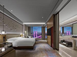 Voodi või voodid majutusasutuse InterContinental Quanzhou by IHG toas