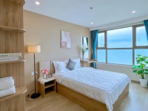 Ένα ή περισσότερα κρεβάτια σε δωμάτιο στο The Sóng Apartment Vũng Tàu-Swimming pool-Near Beach +76 φωτογραφίες