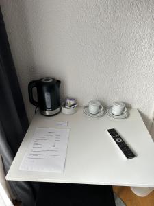 Příslušenství pro přípravu čaje a kávy v ubytování Hotel Thurpark