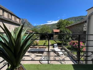 a balcony with a view of the mountains at Maison du plateau de beille in Les Cabannes +9 photos