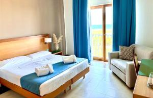 Postel nebo postele na pokoji v ubytování Hotel Scoglio Degli Achei + 37 fotografií