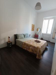 a bedroom with a bed with a blanket on it at GTapartment in Rome
