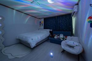 a bedroom with a bed and a star ceiling at Anime House in Daejeon
