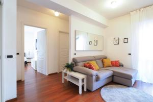 a living room with a couch and a table at Primopiano - Bonghi B in Milan