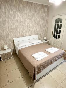 A bed or beds in a room at Rooms & Restaurant Il Castagneto