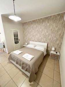 A bed or beds in a room at Rooms & Restaurant Il Castagneto