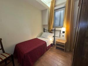 A bed or beds in a room at Locanda Fosca Umbra