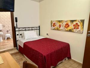 A bed or beds in a room at Locanda Fosca Umbra