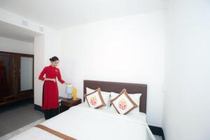 Postel nebo postele na pokoji v ubytování The Rice 131 Bui Vien Hotel