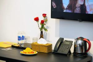 TV a/nebo společenská místnost v ubytování The Rice 131 Bui Vien Hotel